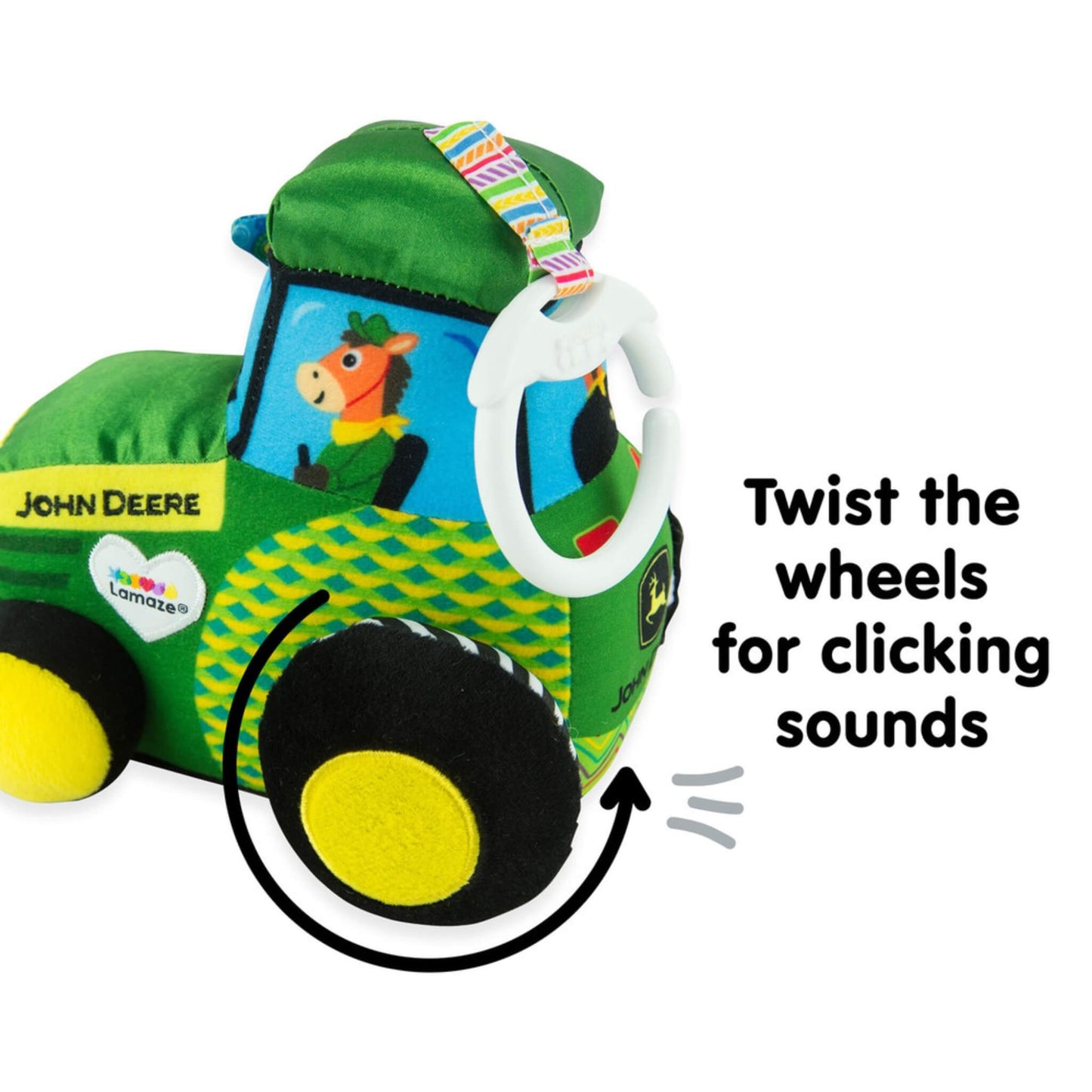 Close-up showing plush tractor wheel being twisted to create gentle clicking sounds for sensory play.
