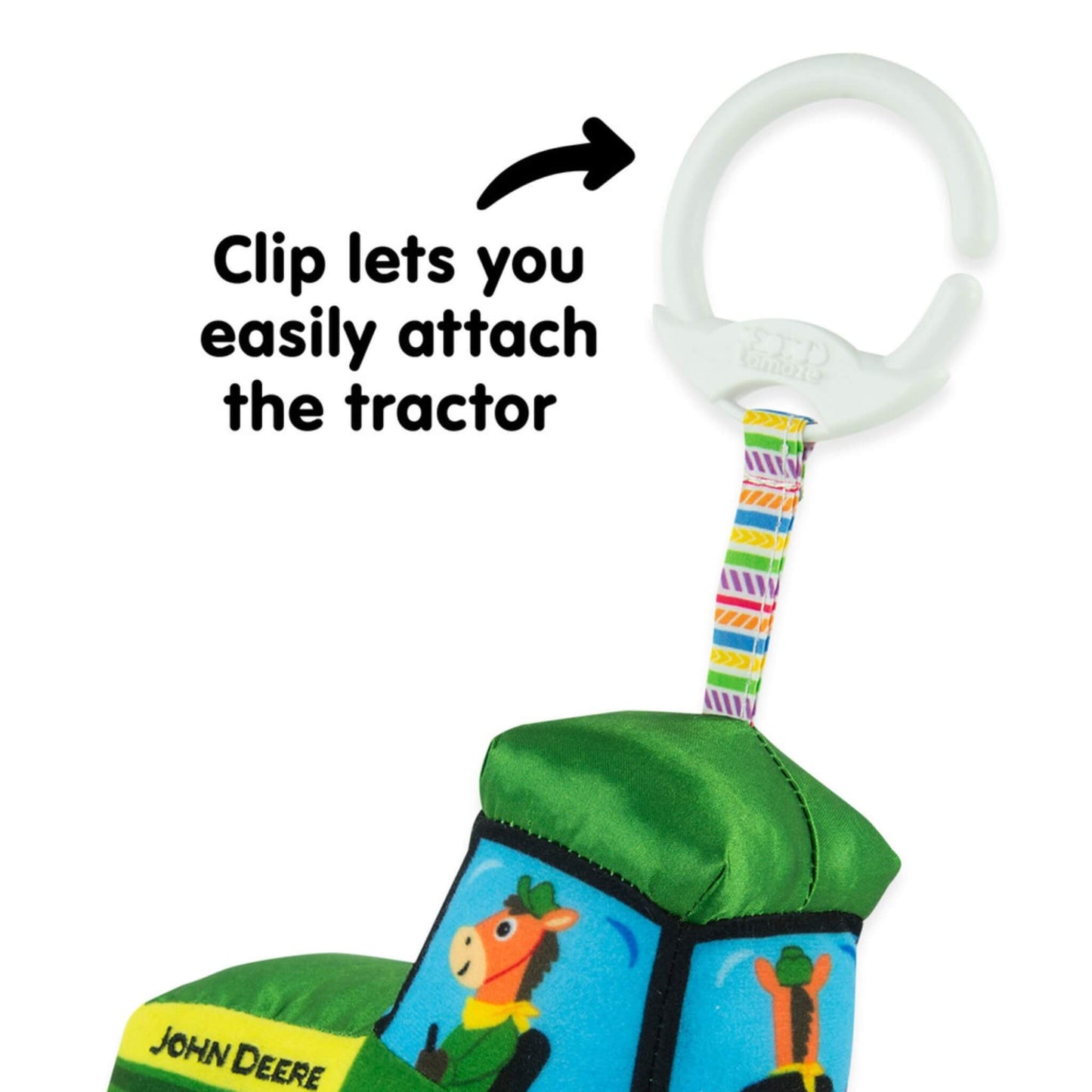 Detail showing the white clip and patterned strap used to attach the toy securely to a pram or bag.