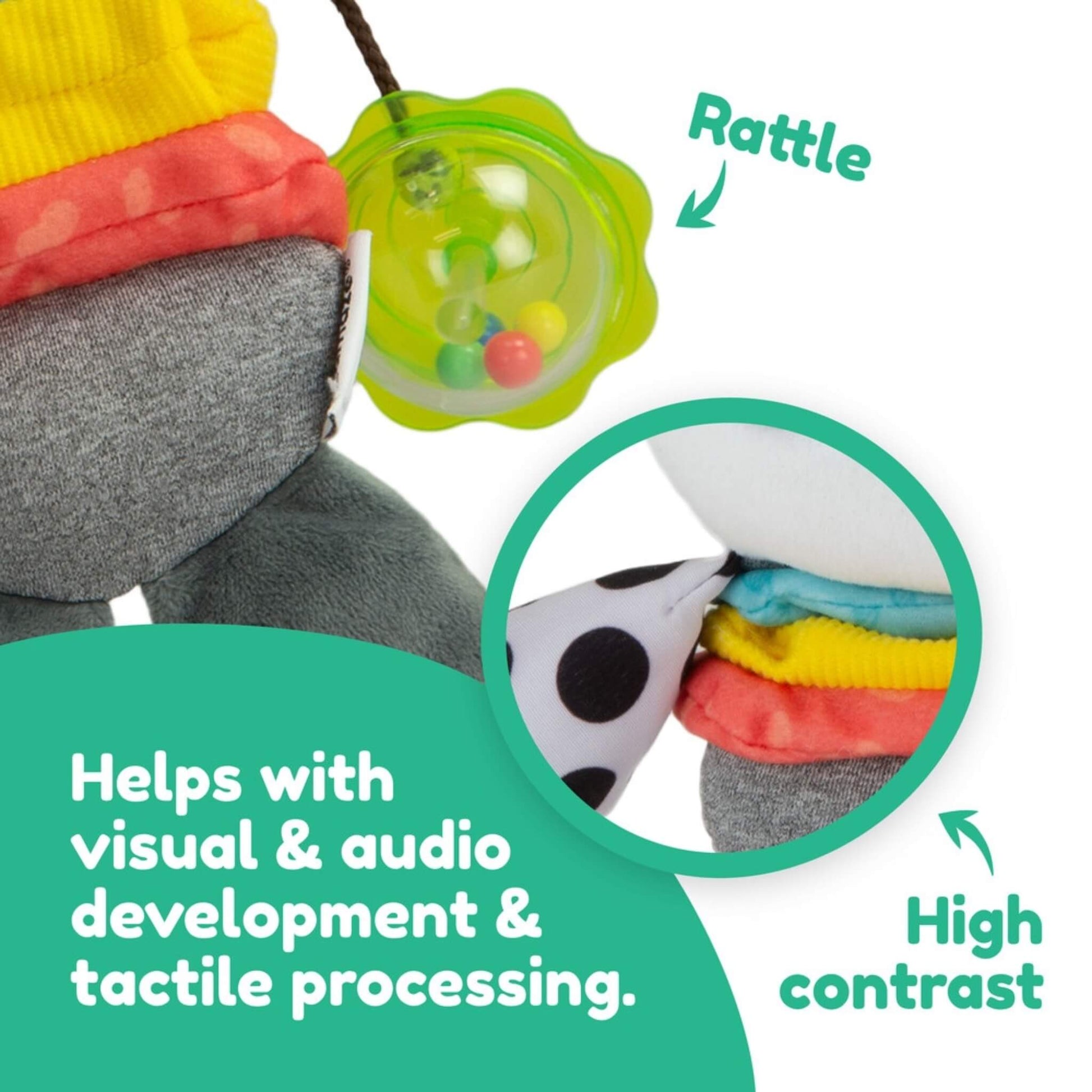 Close-up of a baby toy’s green rattle and textured fabrics designed to support sensory exploration and fine motor skills.