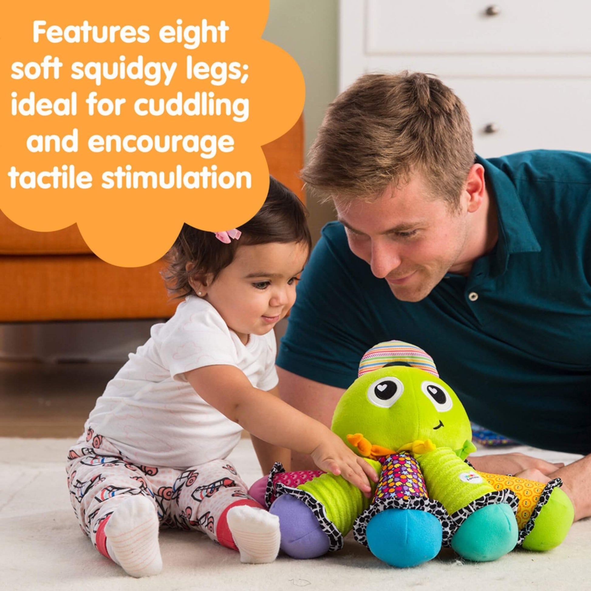 Baby sitting on a carpeted floor smiling while touching the colourful octopus toy, with text bubble describing its soft, squidgy legs.