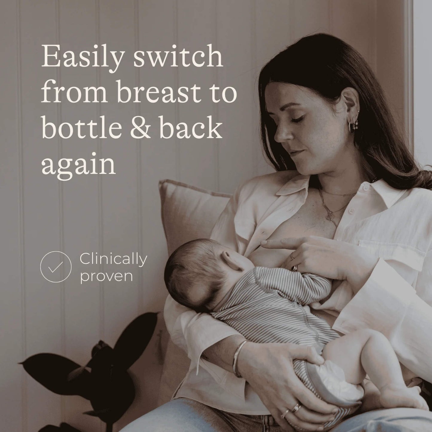 Mother holding baby during feeding, demonstrating natural breast-to-bottle transition in a calm, home setting.