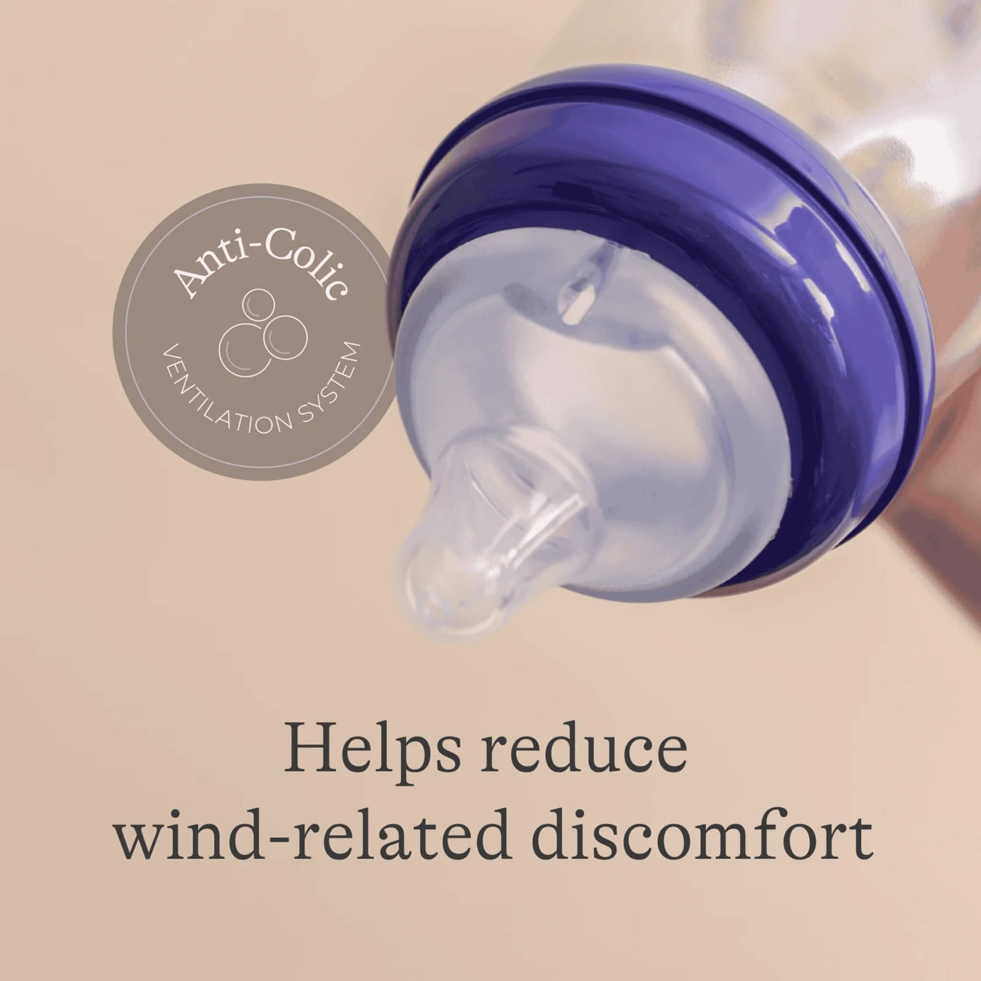 Feeding bottle tilted to reveal flexible silicone teat and anti-colic valve designed to reduce wind-related discomfort.