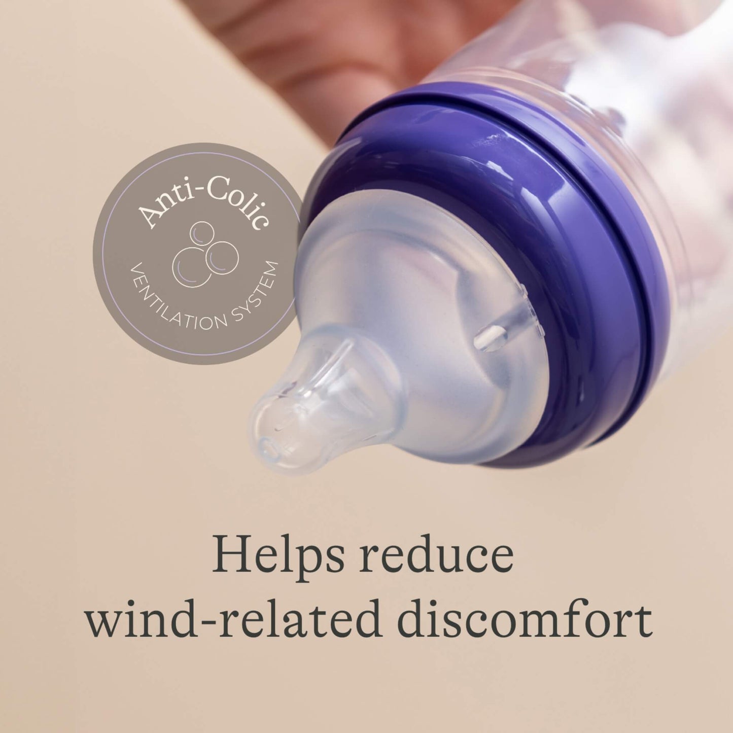 Close-up of a feeding bottle teat and collar showing an anti-colic ventilation system designed to help reduce swallowed air and wind-related discomfort.