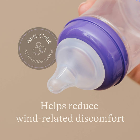 Close-up of a feeding bottle teat and collar highlighting an anti-colic ventilation system designed to help reduce swallowed air and wind-related discomfort.