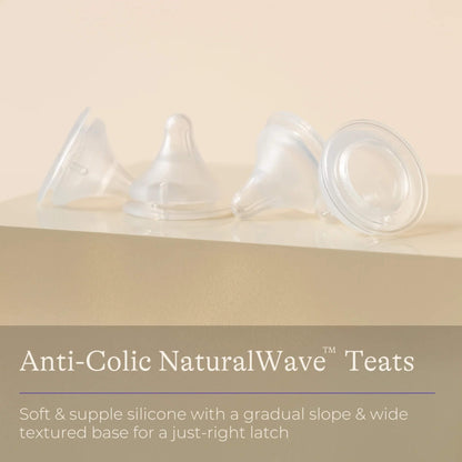 Four clear silicone baby bottle teats displayed in a row on a neutral background with information highlighting soft silicone, gradual slope and wide textured base design.