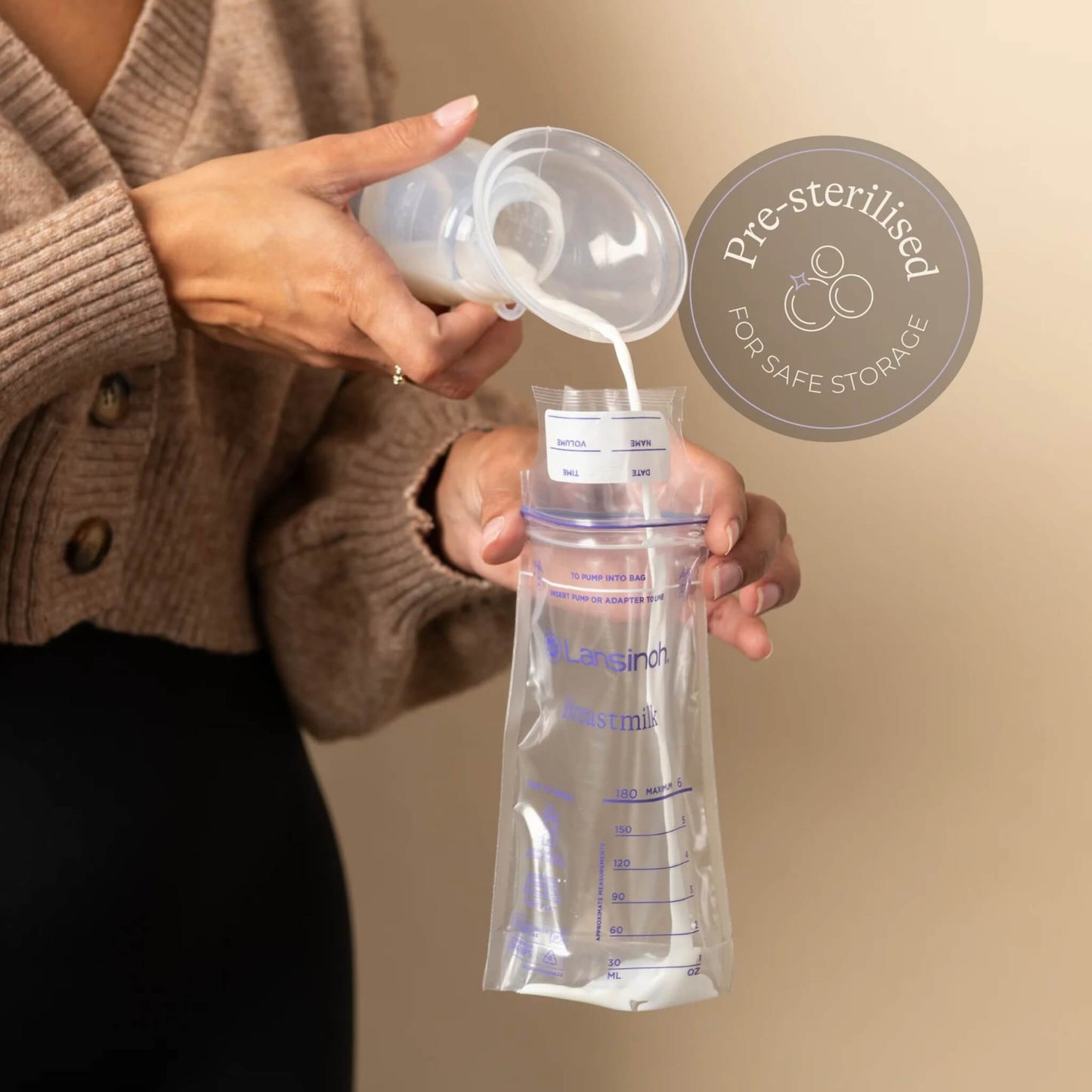 Person pouring expressed milk from a collection bottle into an open breastmilk storage bag with pre-sterilised storage message shown beside the product.
