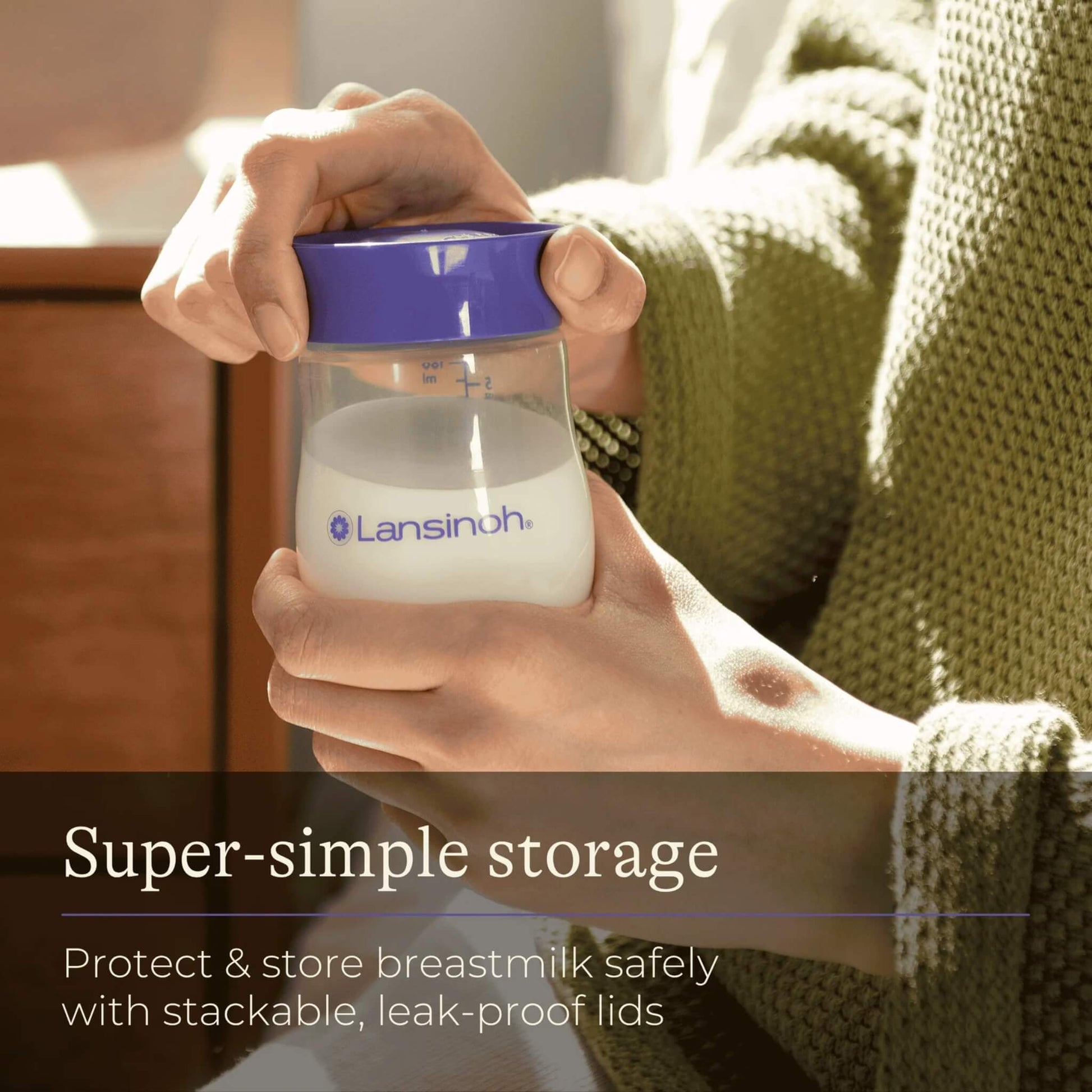 Person closing a filled breastmilk storage bottle with a purple lid, demonstrating simple, leak-proof use.