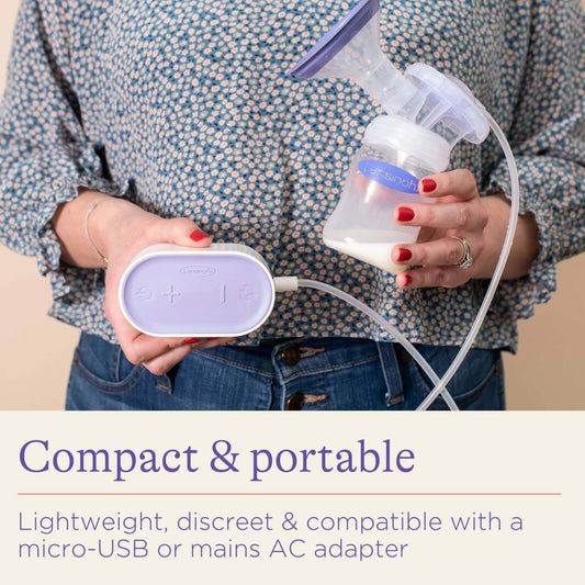 Mother holding a compact electric breast pump in one hand and bottle of expressed milk in the other, showing its lightweight and portable design for easy use.