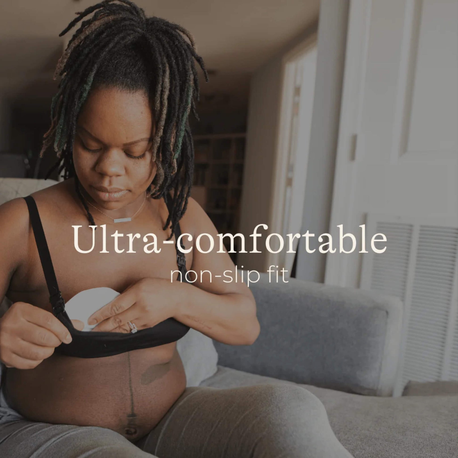 Mother placing a soft disposable breast pad inside her bra for comfort and protection against leaks.