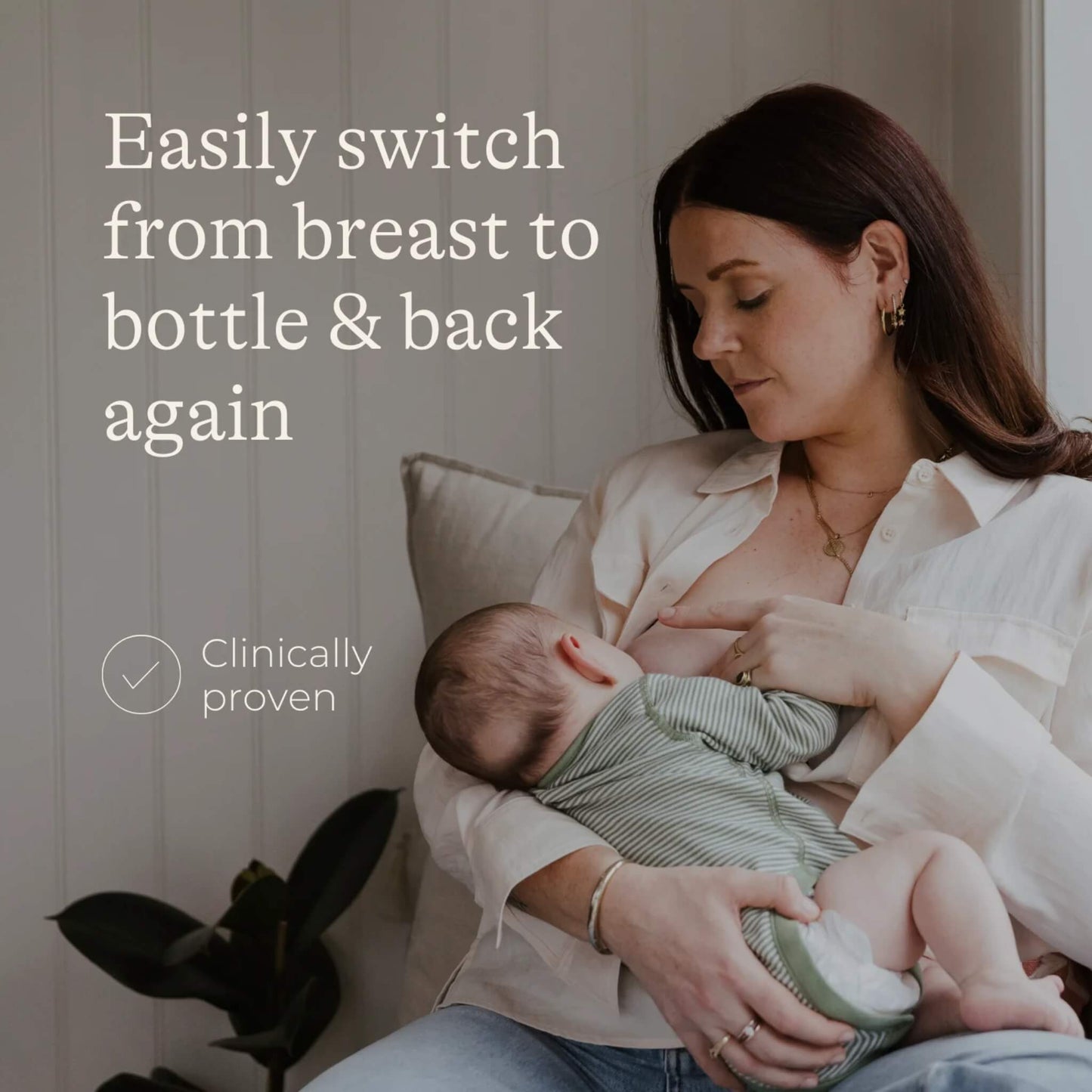 A woman breastfeeding a baby while seated indoors, illustrating a feeding routine that combines breast and bottle feeding.