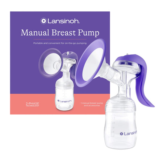 Lansinoh Manual Breast Pump with ergonomic purple handle and soft ComfortFit breast cushion, shown beside packaging with 2-phase technology label.