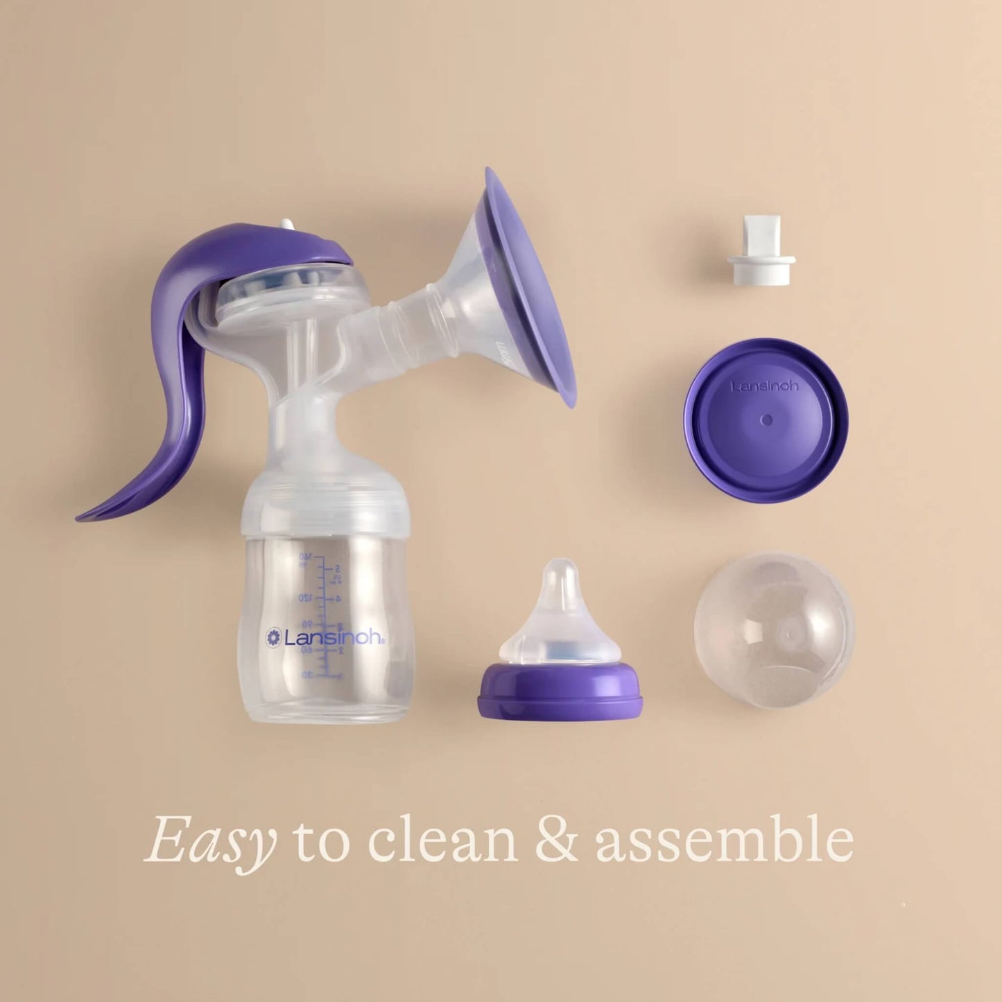 Manual breast pump disassembled into separate parts, showing how easy it is to clean and reassemble after expressing.