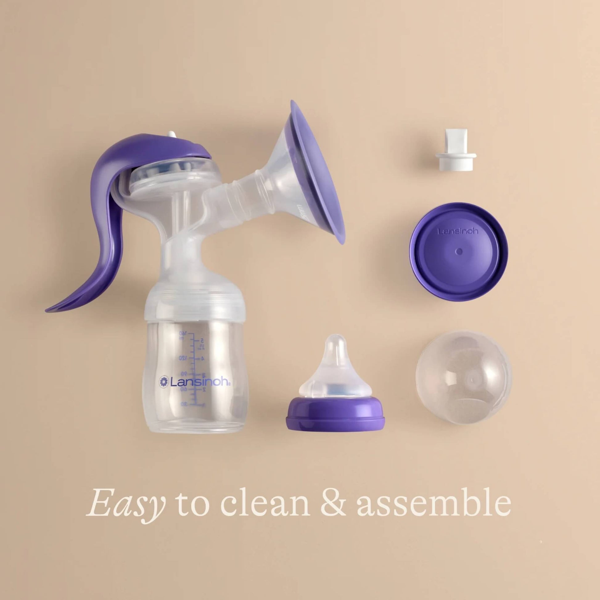 Manual breast pump disassembled into separate parts, showing how easy it is to clean and reassemble after expressing.