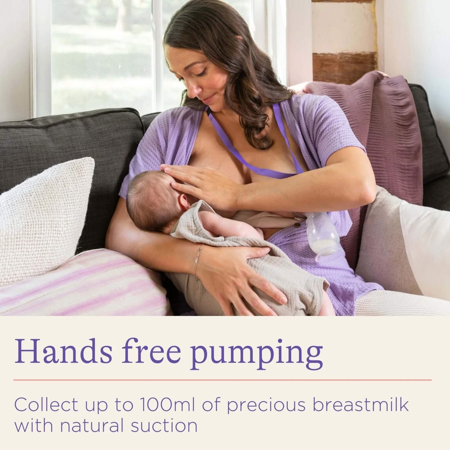 Mother breastfeeding her baby while a small silicone breast pump collects milk from the other breast using natural suction.