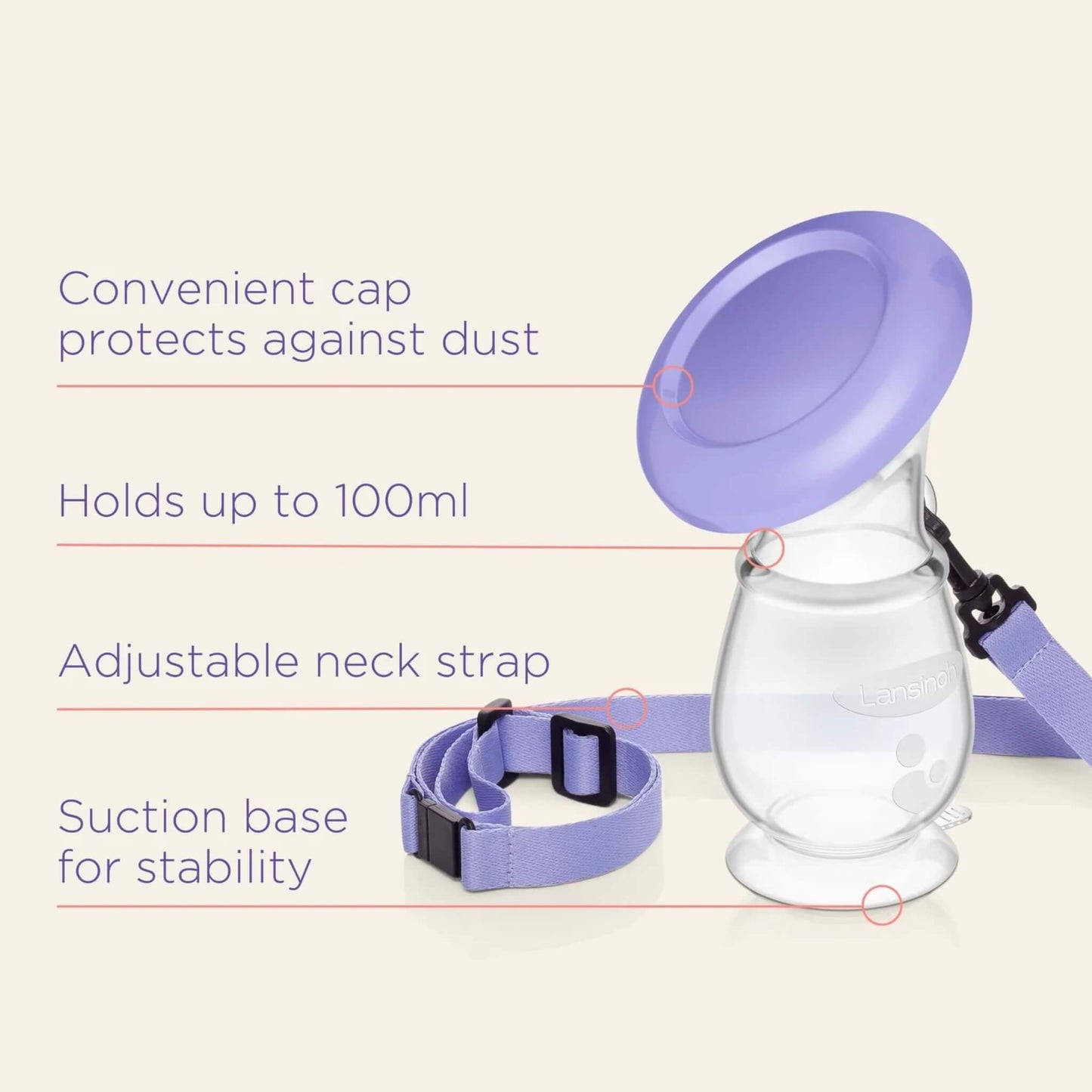Compact silicone breast pump with purple lid and strap, shown upright on a smooth surface with suction base for stability and 100ml capacity marking.