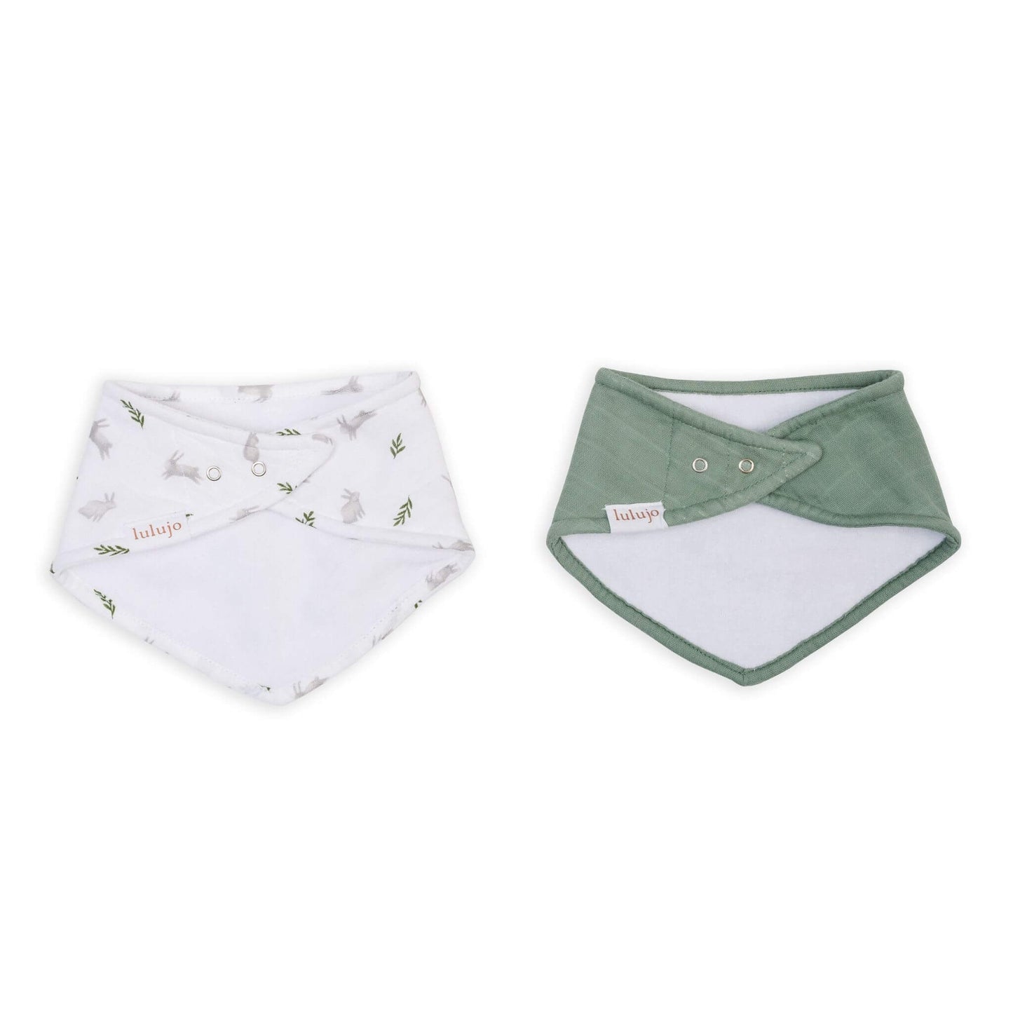Lulujo bandana bibs with adjustable snaps shown from reverse side, featuring white bunny print and solid sage green, highlighting the practical design and quality construction.