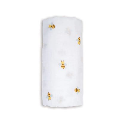 Soft Lulujo Cotton Muslin Swaddle in the Bees design, neatly rolled to show its lightweight white fabric patterned with yellow and brown bees.