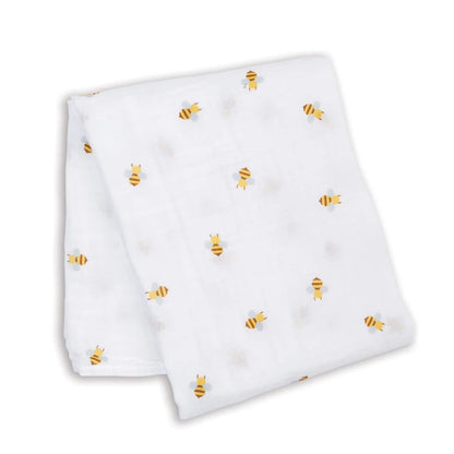 Lightweight muslin swaddle laid flat, showing the repeating bee pattern across the white cotton fabric.