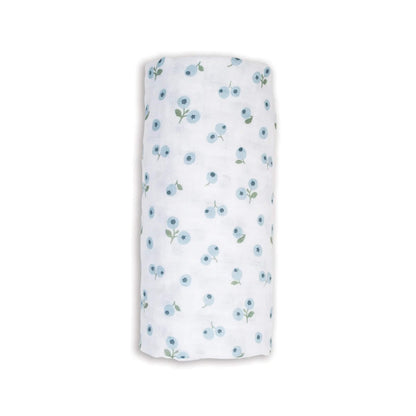 Lulujo Cotton Muslin Swaddle in the Blueberries design, neatly rolled to show its soft white fabric patterned with delicate blue berry clusters.