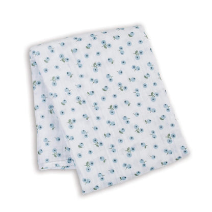 Lightweight muslin swaddle folded flat, showing the repeating pattern of small blue berries with green stems across the white cotton fabric.