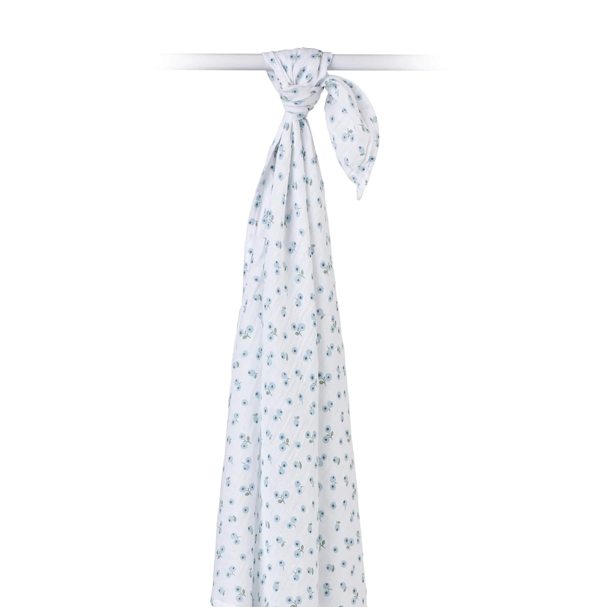 Cotton muslin swaddle draped over a rod, highlighting its airy, semi-sheer texture and gentle berry print.
