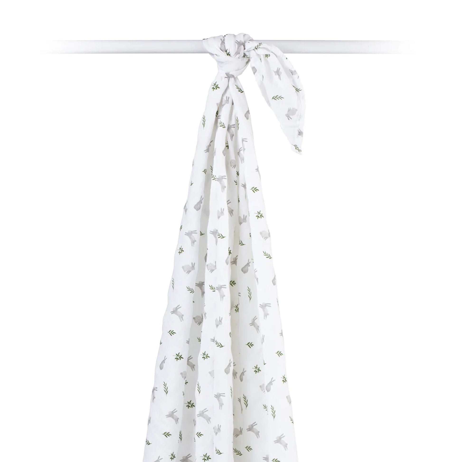 Cotton muslin swaddle draped over a rod, showing its airy, semi-sheer texture and all-over bunny print.
