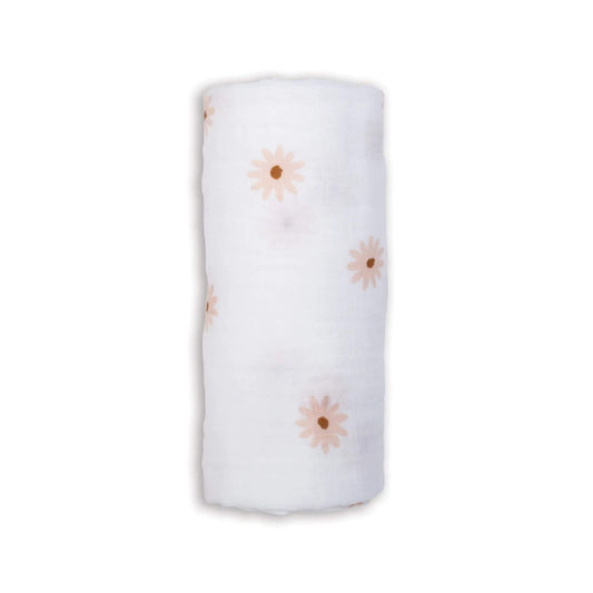 Lulujo Cotton Muslin Swaddle in the Daisies design, neatly rolled to show its soft white fabric patterned with gentle peach-toned daisy flowers.