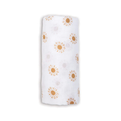 Lulujo Cotton Muslin Swaddle in the Suns design, rolled neatly to show soft white fabric patterned with warm golden sun illustrations.