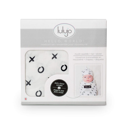Lulujo Hello World gift box packaging showing complete newborn set with swaddle, hat and photo sticker, ideal for baby showers and registry gifts.