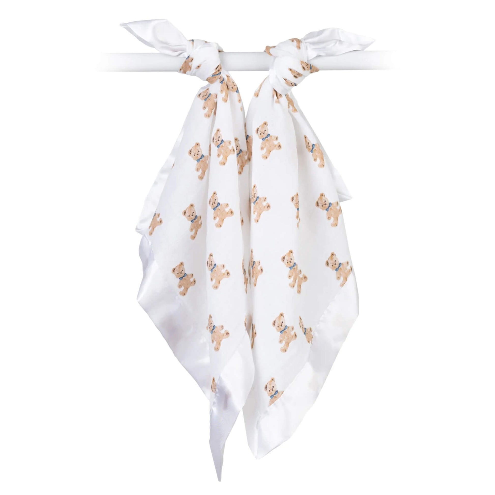 Pair of white muslin comfort blankets with teddy bear design, tied over a rail to display their lightweight fabric.