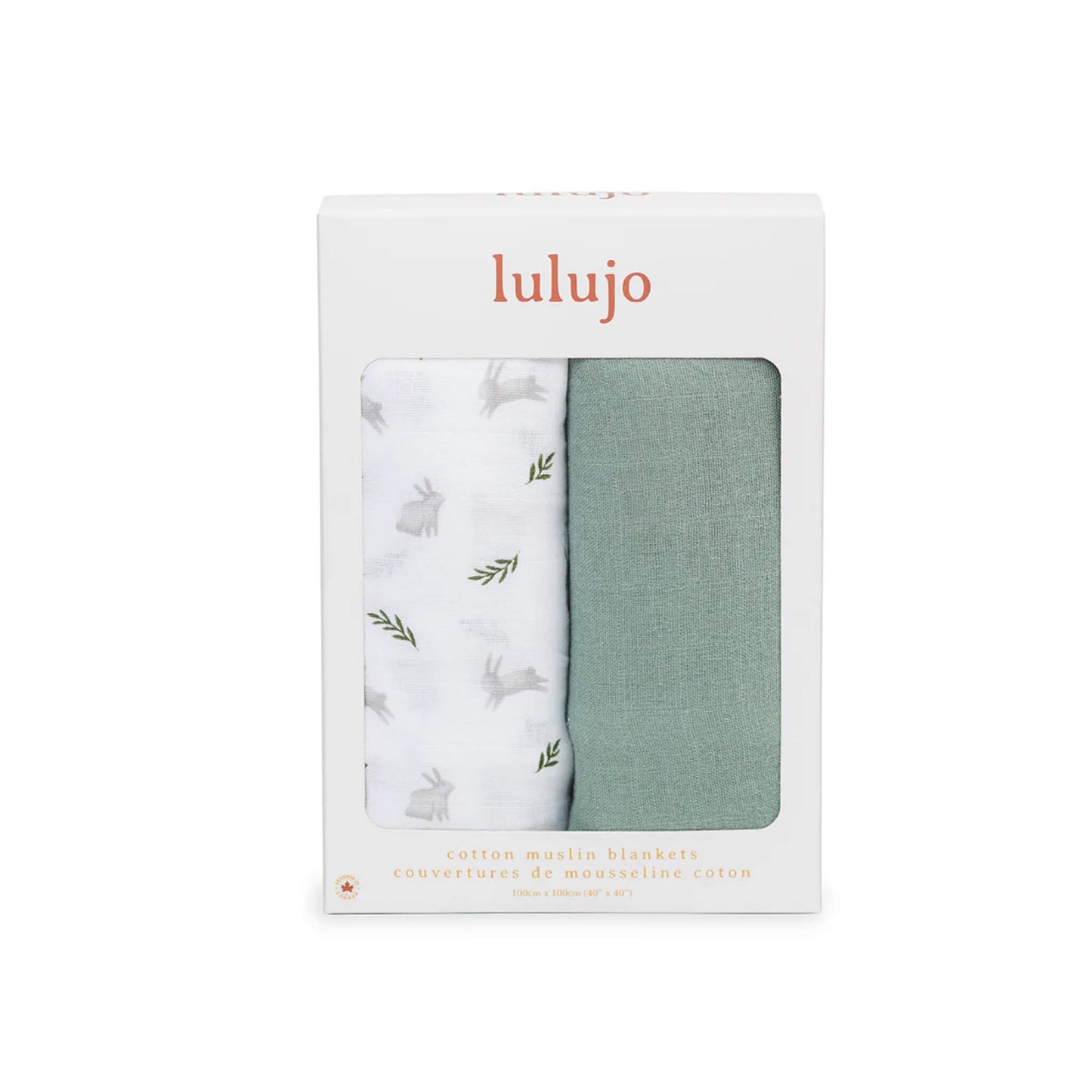 Boxed Lulujo 2-pack cotton muslin swaddles in packaging with one green and one white bunny-print blanket visible through the front window.