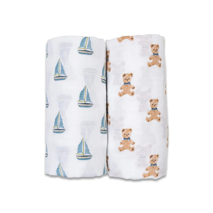 Pack of 2 Lulujo Muslin Swaddles with vintage Bears & Sailboats rolled side by side, one printed with teddy bears and one with blue sailboats on white muslin fabric.