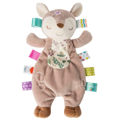 Mary Meyer Taggies Lovey soft comforter featuring a sleepy Flora Fawn character, woodland print tummy and colourful sensory ribbon tags.