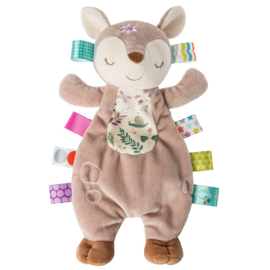Mary Meyer Taggies Lovey soft comforter featuring a sleepy Flora Fawn character, woodland print tummy and colourful sensory ribbon tags.