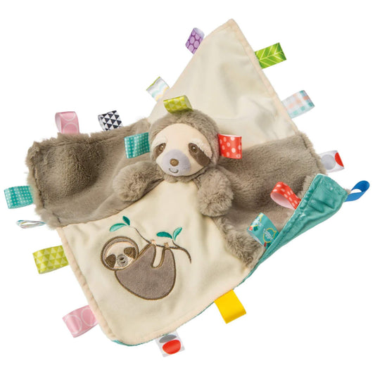 Mary Meyer Taggies Molasses Sloth blanket comforter with a plush sloth head, soft grey and cream fabric, embroidered sloth design and colourful satin ribbon tags around the edges.