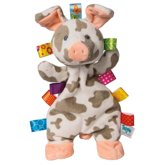 Mary Meyer Taggies Patches Pig Lovey plush comforter with soft pink snout, spotted body and colourful satin ribbon tags around the edges.