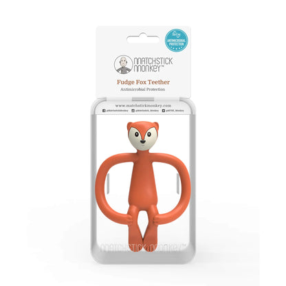 Baby teether displayed inside clear retail packaging with a printed card showing the Fudge Fox name and antimicrobial protection badge.