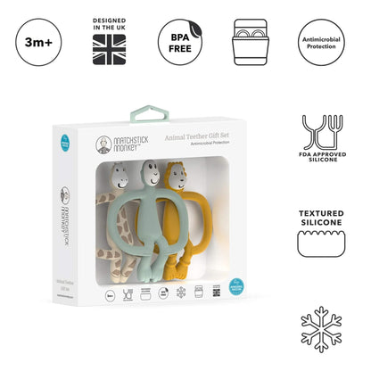 A boxed set displayed upright in white packaging containing three silicone animal-shaped teethers in beige, sage green and mustard, surrounded by simple feature icons.