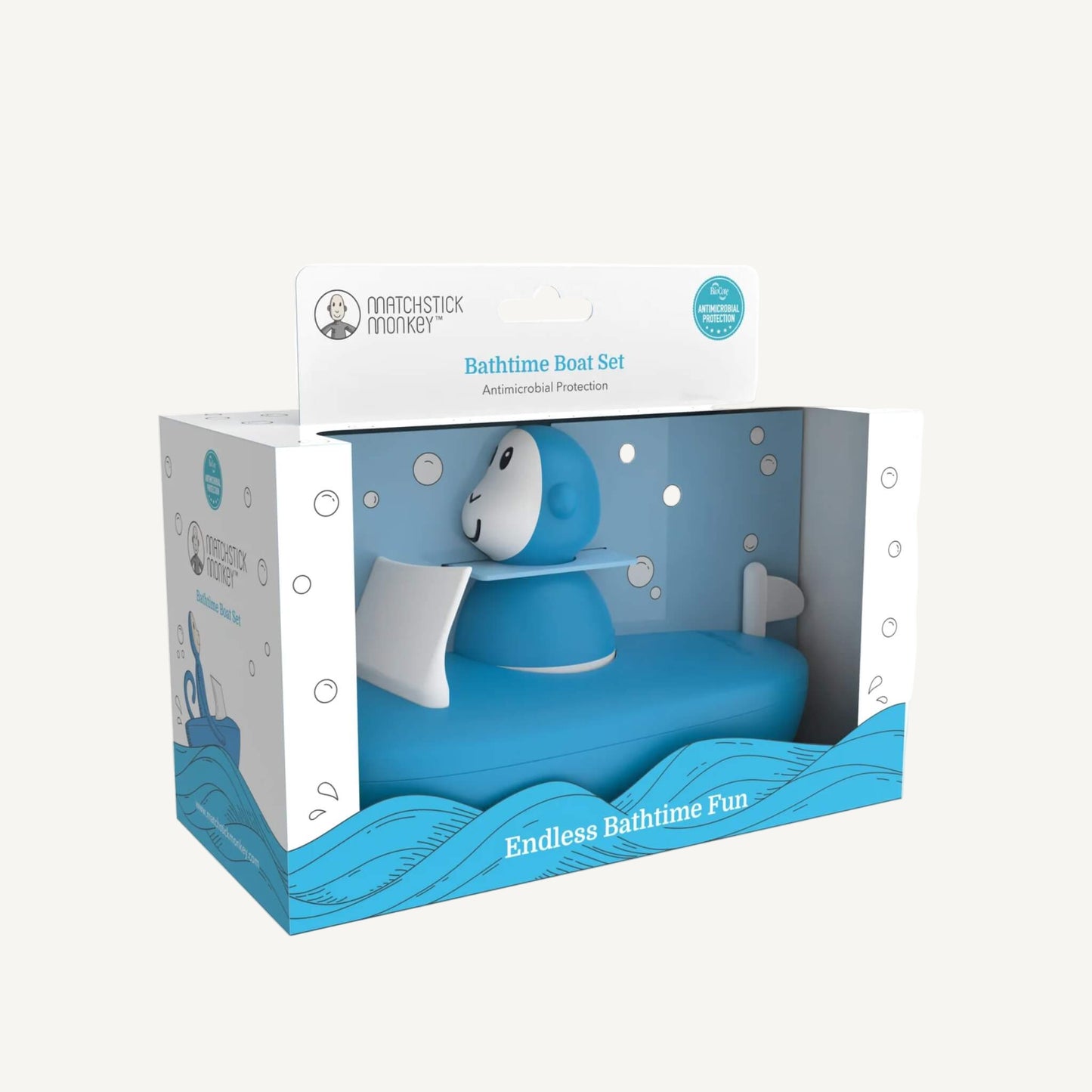 Blue bath boat toy packaged inside a retail display box with a clear window and illustrated bubble and wave graphics.