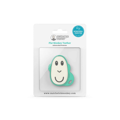 A flat monkey-shaped silicone teether packaged inside a clear blister pack with simple white card backing.