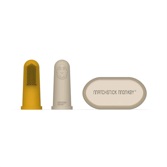 Matchstick Monkey Finger Toothbrush set with yellow and beige silicone brushes and protective carry case.