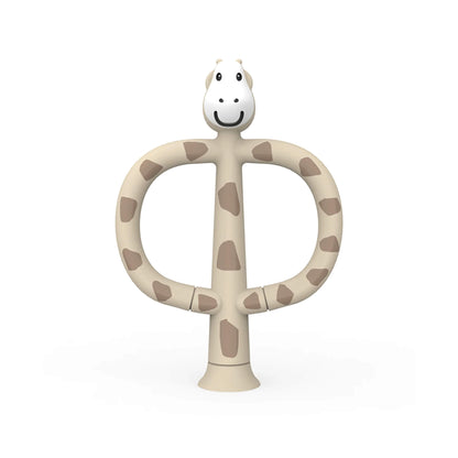 Matchstick Monkey Giraffe Training Toothbrush shown upright with wide looped handles, a smiling giraffe head and soft silicone detailing in a neutral spotted design.