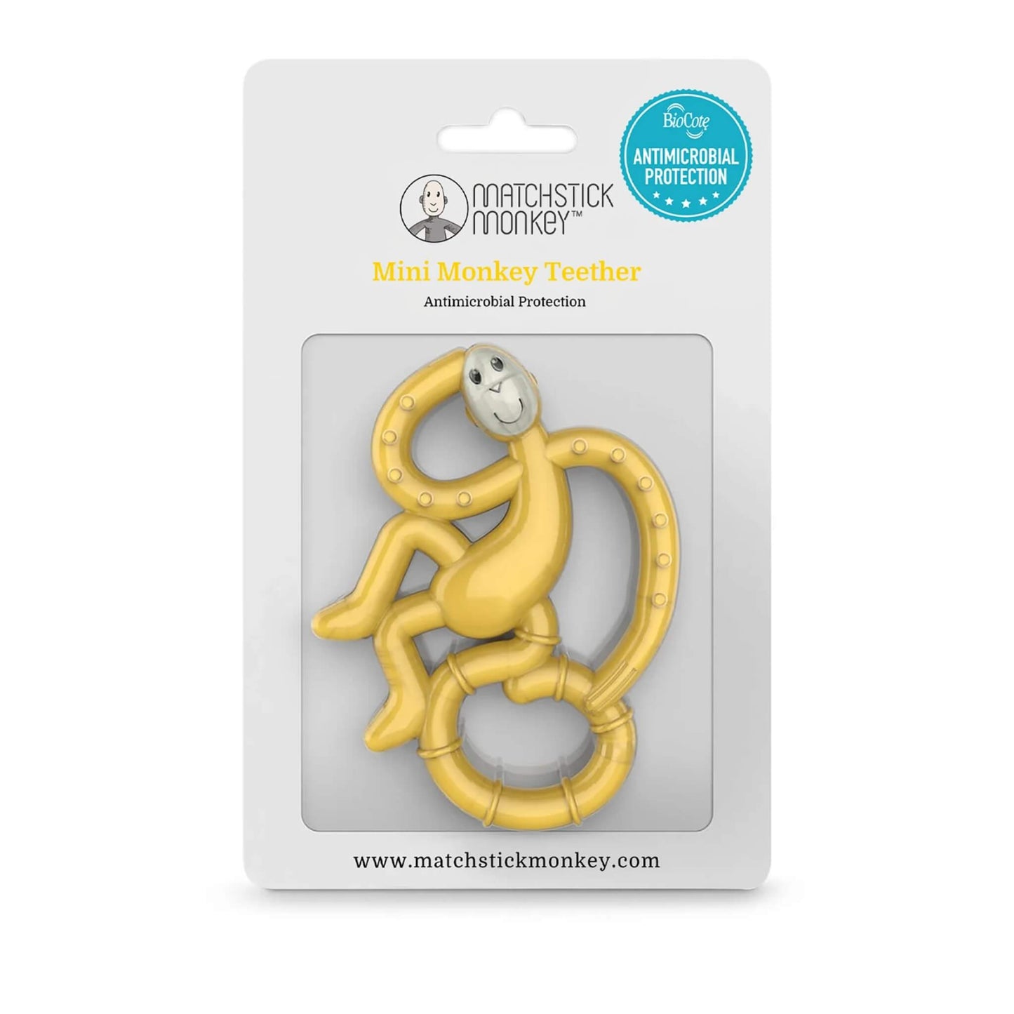 A yellow monkey-shaped teether inside its retail packaging, displayed against a white card backing with antimicrobial protection badge.