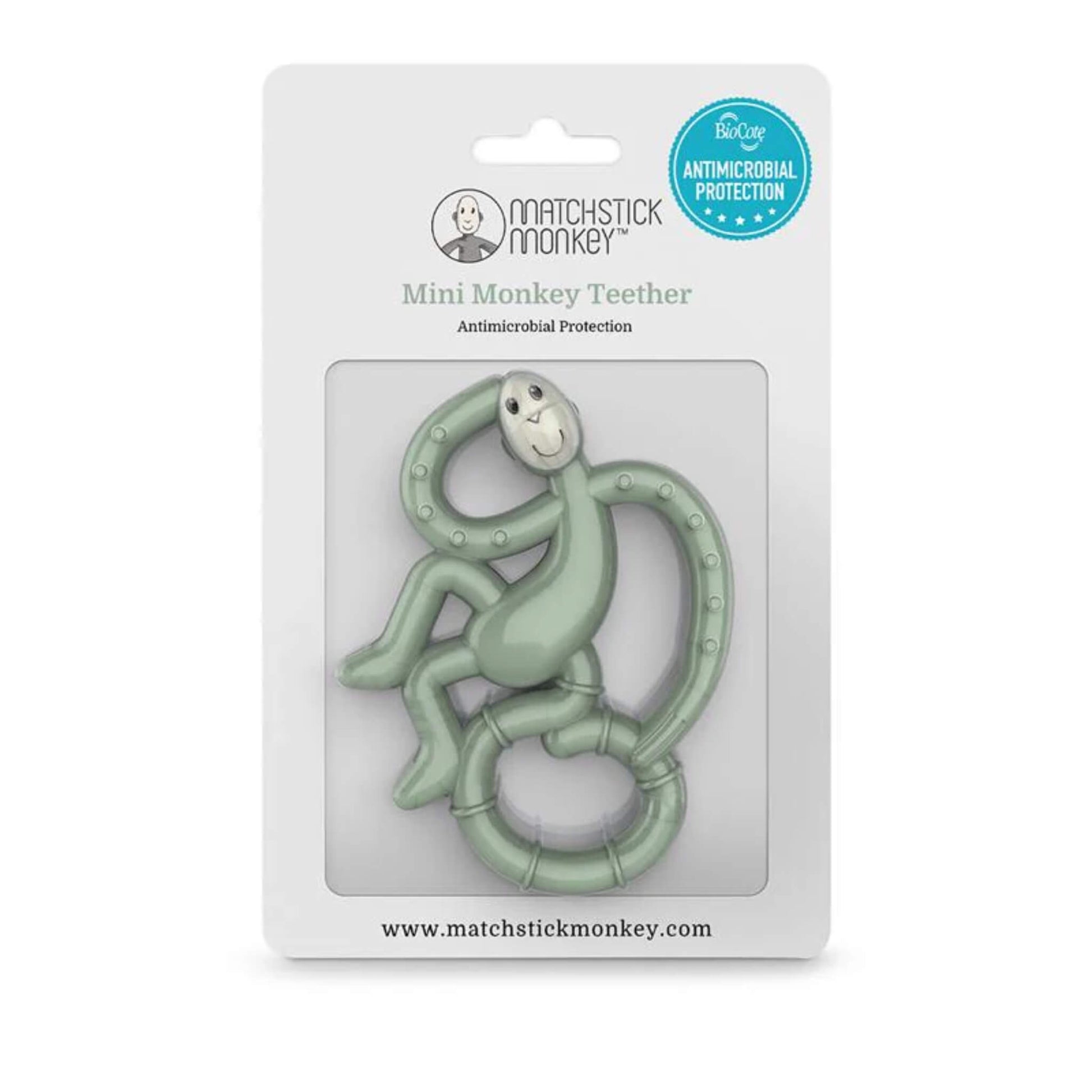 Mint green monkey teether displayed in retail packaging with antimicrobial protection badge and product branding.