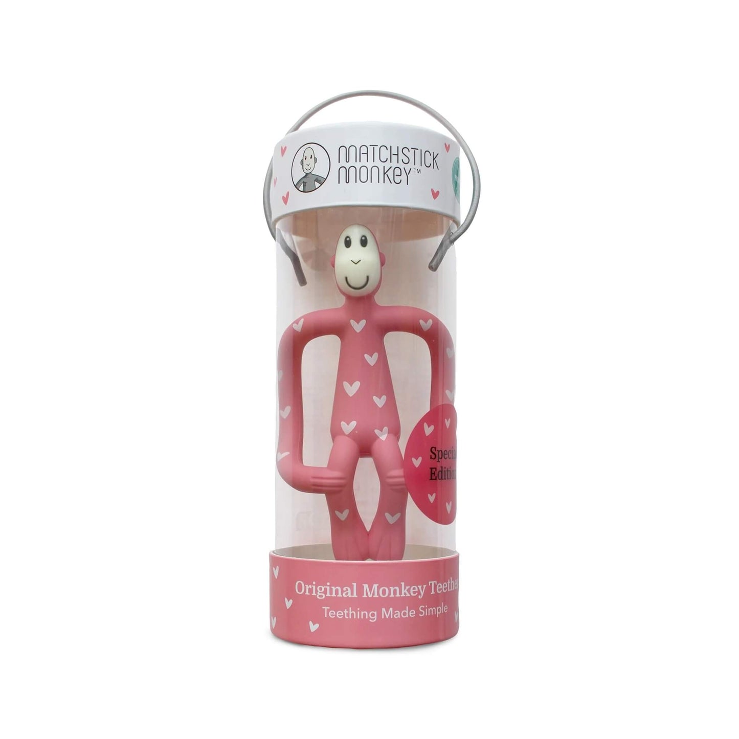 Pink heart-patterned monkey teether displayed inside a clear Matchstick Monkey presentation tube with carry handle.