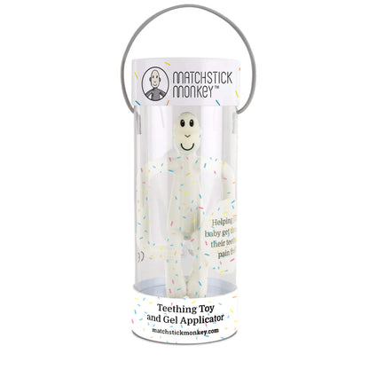 A clear cylindrical gift tube containing a speckled silicone baby teether, with a carry handle attached to the lid.