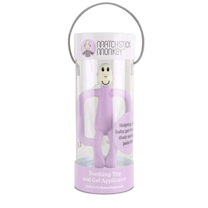 A lilac silicone monkey teether displayed inside a clear cylindrical box with a carry handle and printed branding.