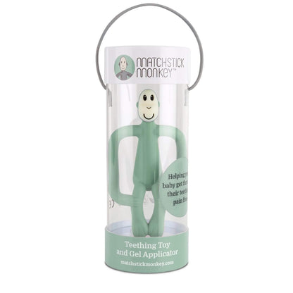 A mint green monkey-shaped teething toy packaged vertically inside a clear cylindrical gift tube with a handle.