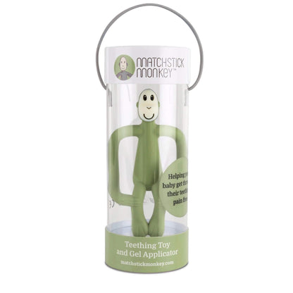 An olive silicone monkey teething toy displayed inside a clear cylindrical box with a carry handle and printed branding.