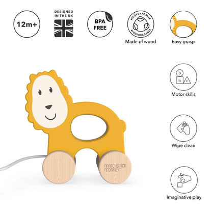 A wooden lion pull-along toy with a cut-out grip and beechwood wheels shown beside icons highlighting wipe-clean material, motor skills and imaginative play benefits.